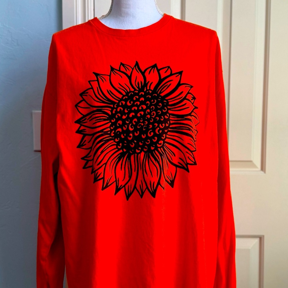 Delta Black Sunflower on an Orange Long Sleeve Tee